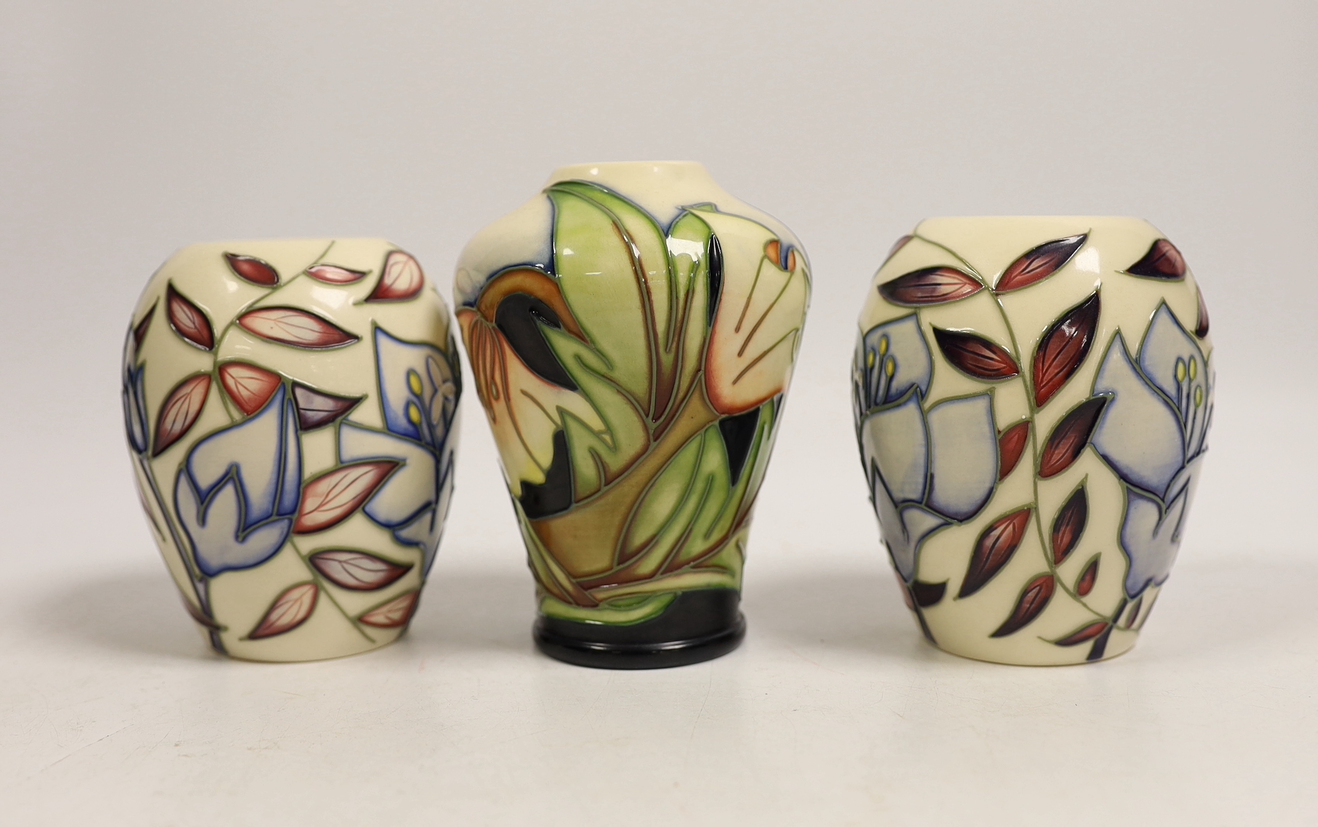 Seven small Moorcroft vases, various patterns. Tallest 10cm